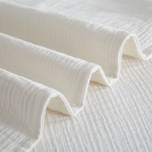 Load image into Gallery viewer, Folded cream ribbed fabric showing texture detail