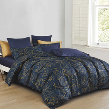 Load image into Gallery viewer, Navy blue duvet cover set with gold floral pattern styled on bed