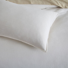 Load image into Gallery viewer, Close-up of cream textured pillow sham on duvet cover