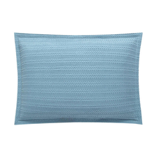 Load image into Gallery viewer, Blue waffle-textured pillow sham on white background