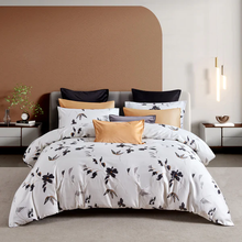 Load image into Gallery viewer, Floral duvet cover set on bed with black and gold accents