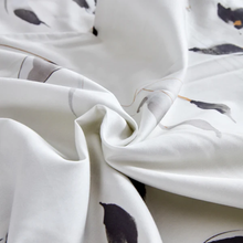 Load image into Gallery viewer, Soft draped white fabric with black floral pattern