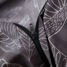Load image into Gallery viewer, Dark leaf print duvet cover zipper closure detail
