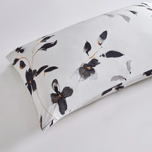 Load image into Gallery viewer, Pillow with black floral print on white background
