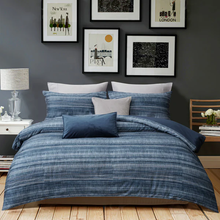 Load image into Gallery viewer, Blue striped duvet cover set styled on bed in modern bedroom

